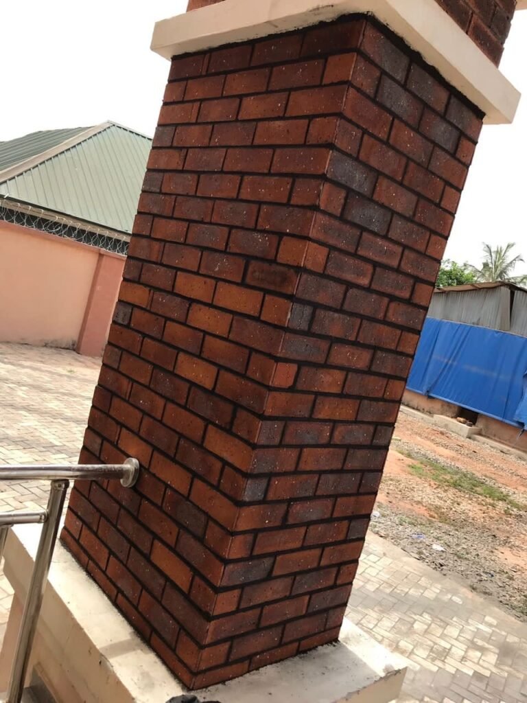 Brick-clad column with decorative wall finishing, Enugu